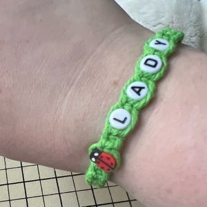 Adjustable cotton cord on hemp with beads, “lady bug”